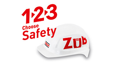 White helmet with Züblin logo, above it the text 1, 2, 3, Decide for safety