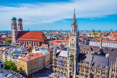 View of St. Mary's Church in Munich with the panorama of the city and the Alps in the background